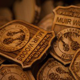 Stack of wooden Muir Woods badges. 