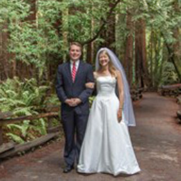 The Bride and Groom of a wedding on a walking path in Muir Woods. 